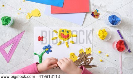 Child Making Spring Card From Colorful Paper And Plasticine, Clay. Handmade. Concept Of Children's C