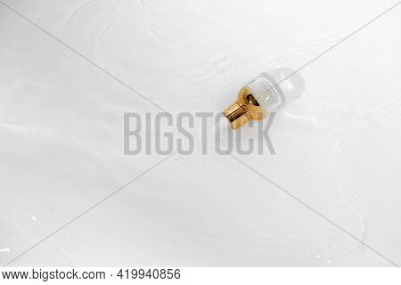 Transparent Golden Bottle With Pipette And Hylauronic Acid. Top Horizontal View Copyspace