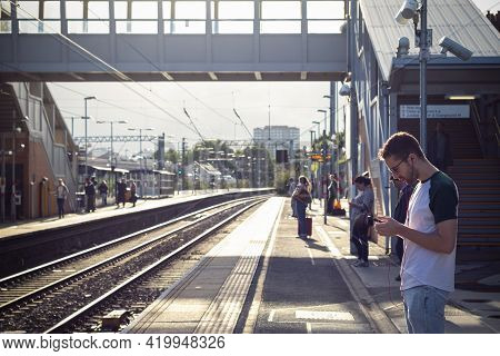 London, Uk - April 16, 2019 - Passengers Waiting For Trains At Platform Of West Hampstead Rail Stati
