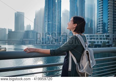 Happy Young Female Traveler In The Big City Of Dubai, Uae