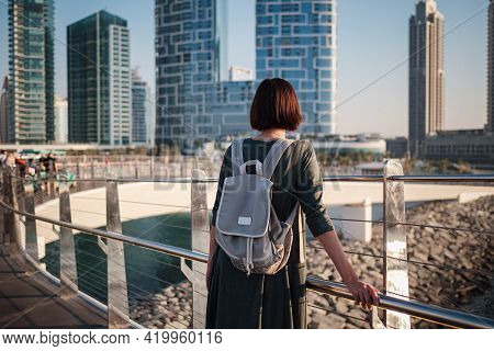Happy Young Female Traveler In The Big City Of Dubai, Uae