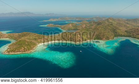 Aerial Seascape Tropical Beach With White Sand And Clear Blue Sea. Tropical Landscape With Islands A