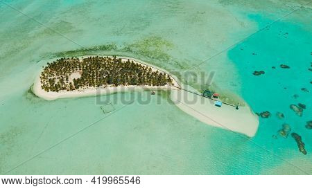 Tropical Island In The Ocean With Palm Trees On White Sand Beach. Onok Island, Balabac, Philippines.