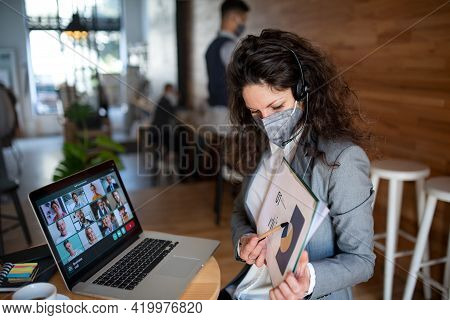 Businesswoman With Laptop Working In Cafe, Freelance Work And Video Call Concept.