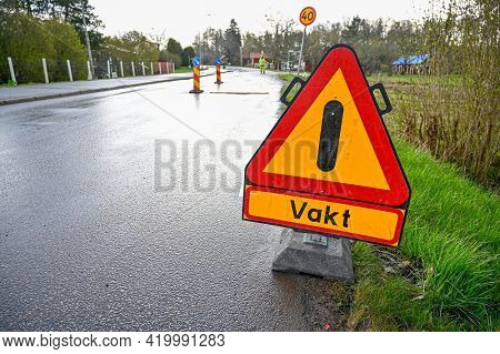 Road Sign With Warning Of Flag Gard