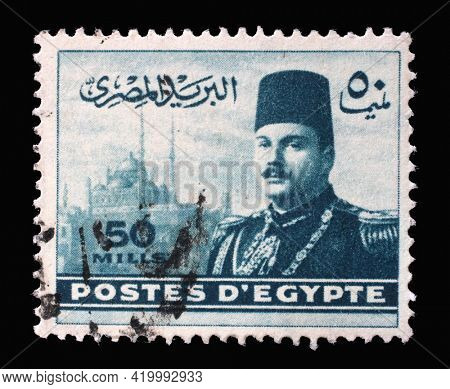 ZAGREB, CROATIA - SEPTEMBER 18, 2014: Stamp printed in Egypt shows King Farouk in front of Cairo Citadel, circa 1947