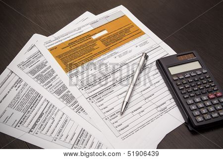 Polish Tax Form With Pen And Calculator On Desk