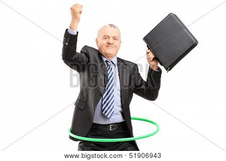 Matue businessman dancing with a hula hoop, isolated on white background