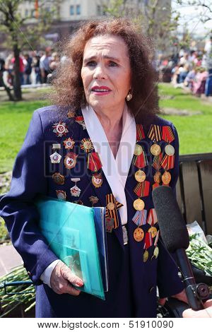 MOSCOW - MAY 9: Veteran interviewed near Bolshoi theater, on May 9, 2013 in Moscow, Russia.  Every year on square in front of Bolshoi Theater traditionally gather veterans of Great Patriotic War.