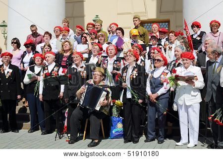 MOSCOW - MAY 9: Sad veterans sing near Bolshoi theater, on May 9, 2013 in Moscow, Russia.  Every year on square in front of Bolshoi Theater traditionally gather veterans of Great Patriotic War.