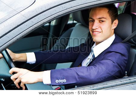 Portrait Of An Handsome Guy Driving His Car