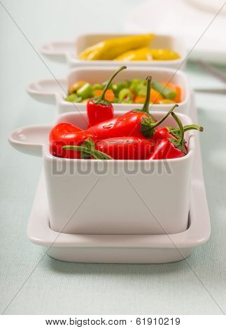 Chili sweet red and pickled green peppers