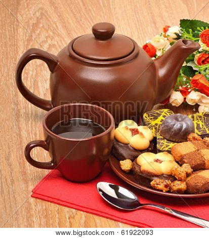 Ceramic Teapot, Cup And Sauser With Biscuits With Flowers