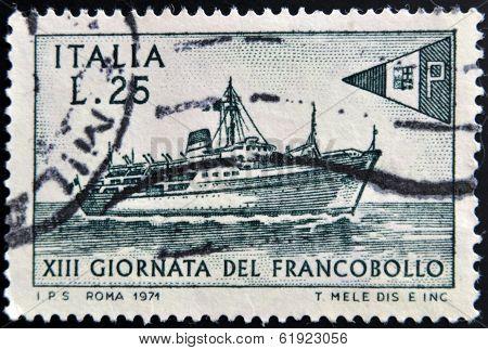ITALY - CIRCA 1971: stamp printed in Italy shows Packet Tirrenia and postal ensign circa 1971