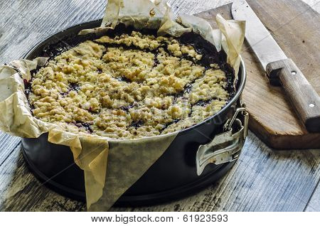 Crumble Pie With Black Currants On Baking Paper
