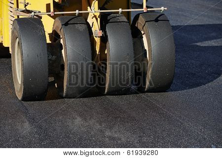 Pneumatic tyred roller compactor at asphalt pavement works for road repairing
