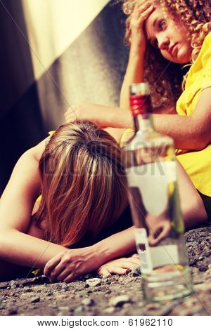 Teen alcohol addiction (drunk teens with vodka bottle) 