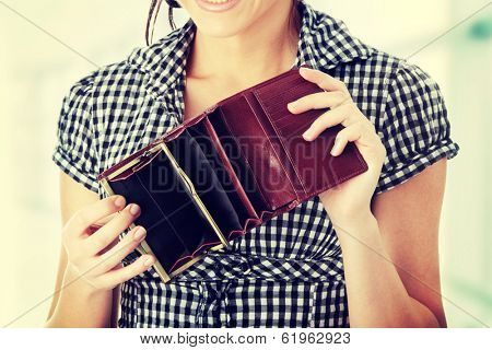 Woman shows her empt  wallet. Bankruptcy