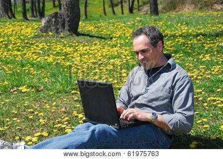 Happy smiling man working outside