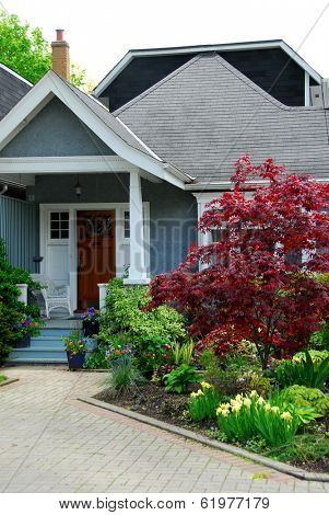 Cozy home with beautuful landscaping