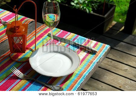 Table setting outside on a deck