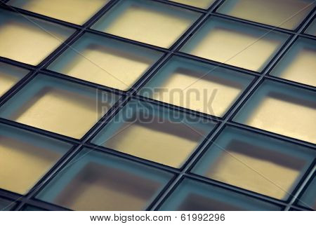 Background of glass squares floor lit from below