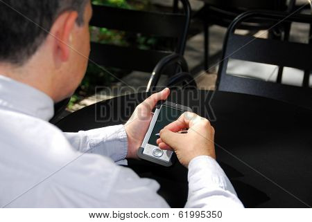 Businessman holding a pda