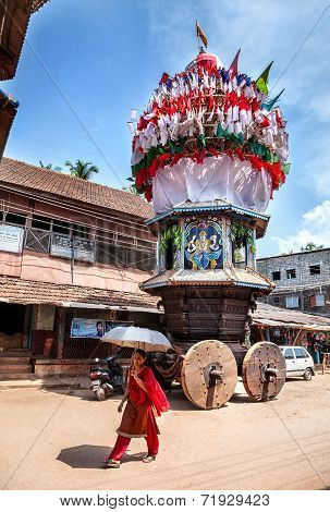 Indian Woman Near Wooden Chariot In India