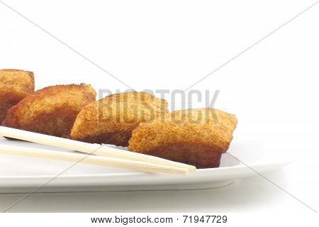 Chinese shrimp toast arranged simple and delightfully isolated on white
