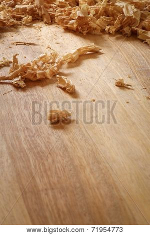 Chip Shavings with Spokeshave of Sapele Hardwood Board