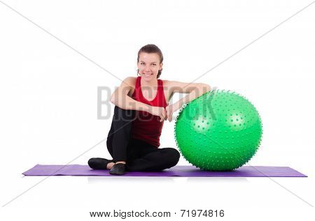 Young woman exercising with swiss ball