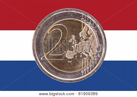 Common Face Of Two Euro Coin On Flag Of Netherlands