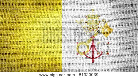 Vatican City flag on burlap fabric