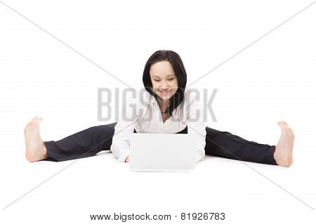 Young Office Woman Sitting In Splits With Laptop On White Background