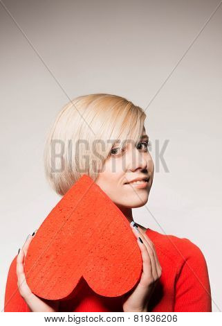 Valentine's Day. Love. Girl holding a heart