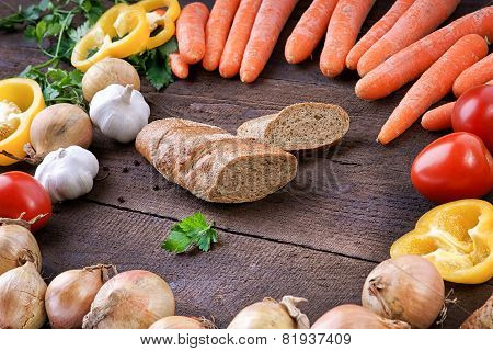 Cutted bread with fresh vegetables on the table