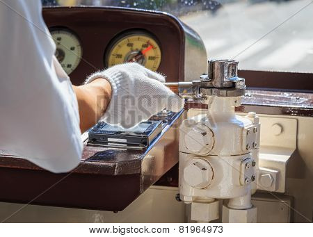 Close Up Of A Hand Of A Japanese Tram Driver