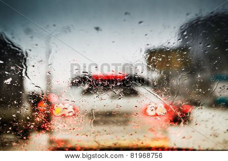 Car Lights Through The Wet Windshield