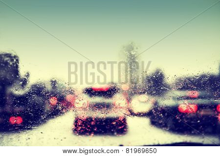 Car Lights Through The Wet Windshield