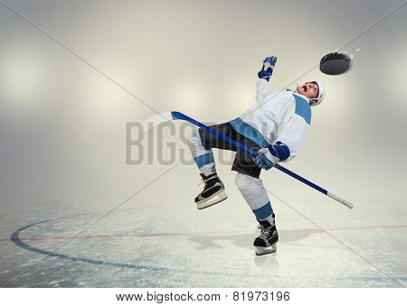 Hockey Player Falls Down On Ice