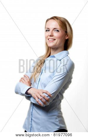 Young blond confident woman with folded arms