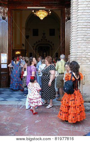 Spanish people entering a church, Marbella.