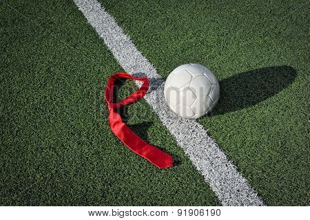 Soccer Ball and Tie on a Soccer Field