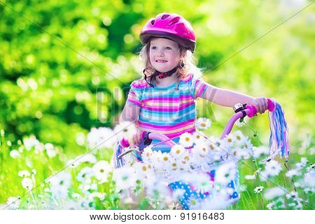 Little Girl Riding A Bike