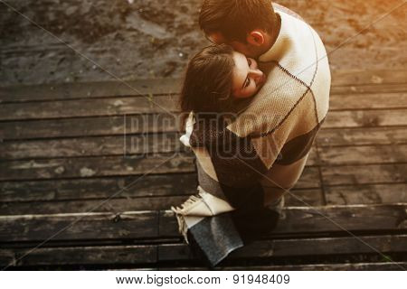 Young couple wrapped in plaid