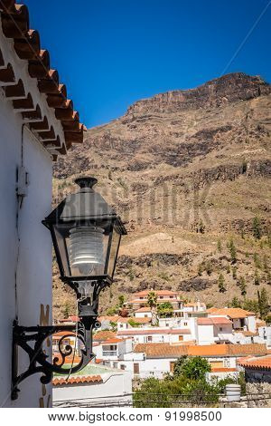 Lamp and rooftops of Fataga
