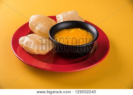 Aamras or Aam Ras Puri: Puri which is an indian fried small bread and alphonso mango pulp is a popular lunch especially during Padwa, the Marathi new year, maharashtrian lunch/dinner menu