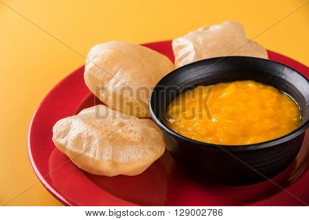 Aamras or Aam Ras Puri: Puri which is an indian fried small bread and alphonso mango pulp is a popular lunch especially during Padwa, the Marathi new year, maharashtrian lunch/dinner menu