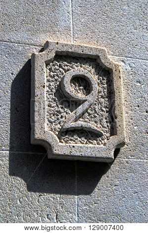 Number two to engrave in the stone blue on a facade of house