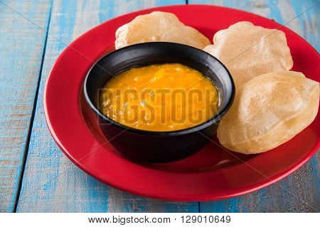 Aamras or Aam Ras Puri: Puri which is an indian fried small bread and alphonso mango pulp is a popular lunch especially during Padwa, the Marathi new year, maharashtrian lunch/dinner menu